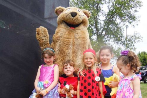 Verona Cattail Festival mascot Cameron the Bog Lemming with young float participants